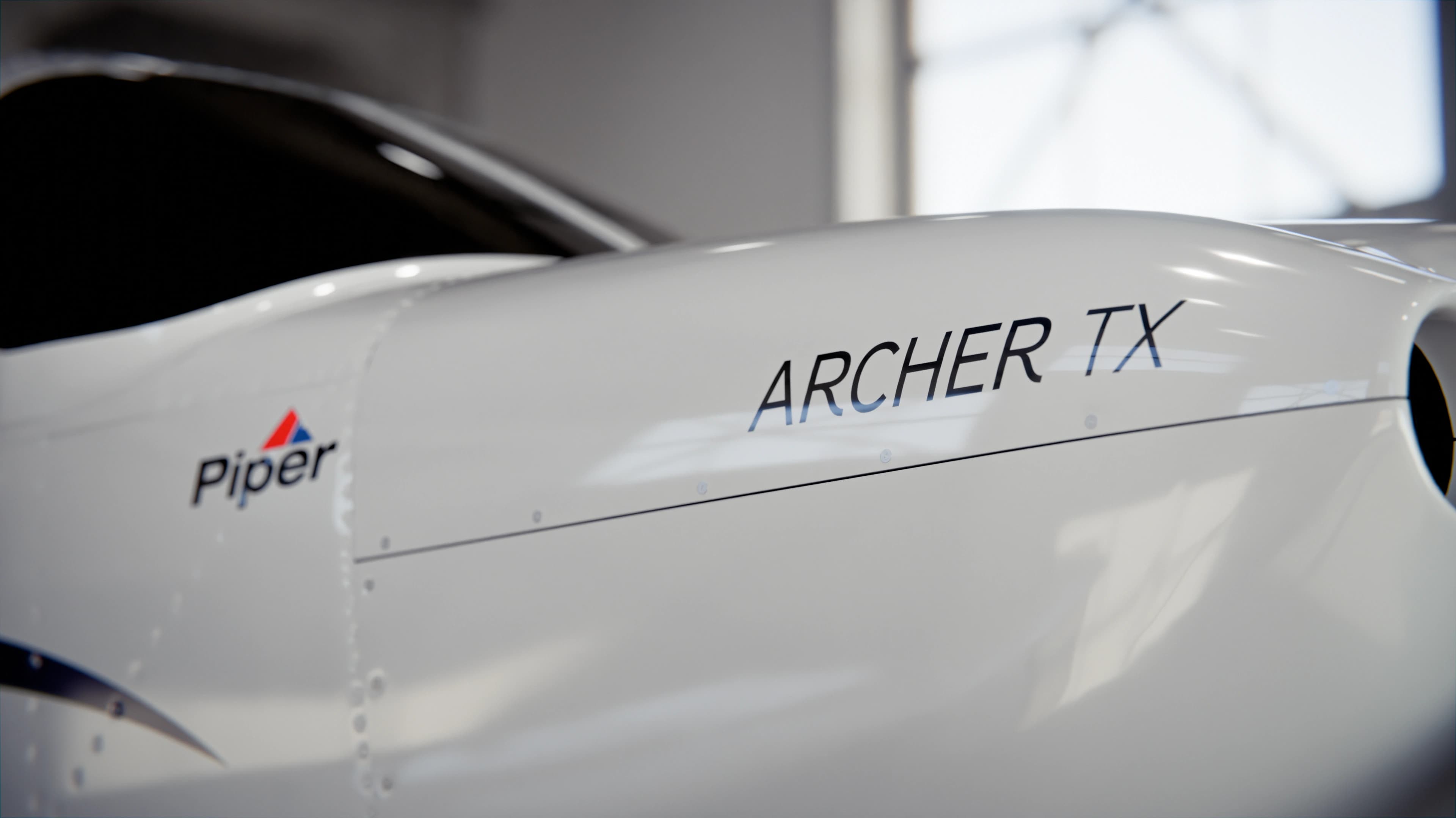Piper Archer TX fuselage detail with the Archer TX wordmark